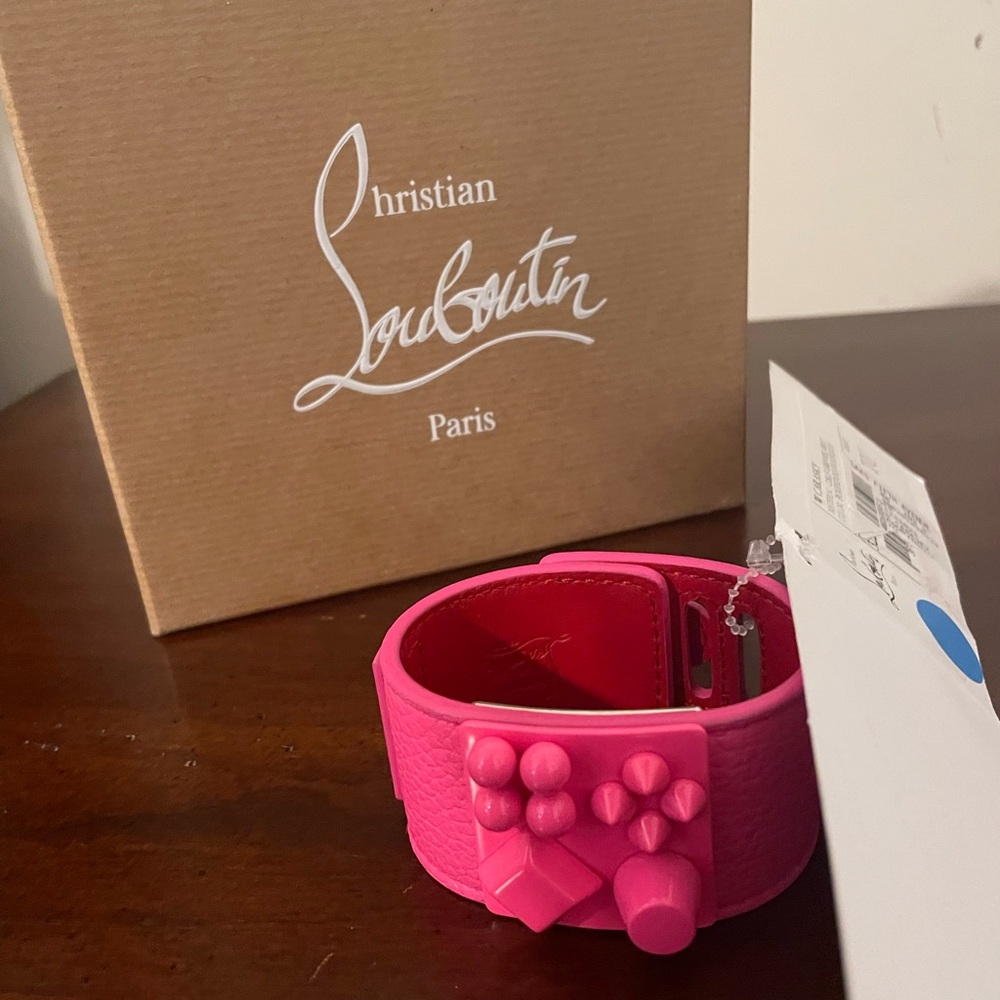 Christian Louboutin's W Carasky bracelet in The bright Poupidou pink